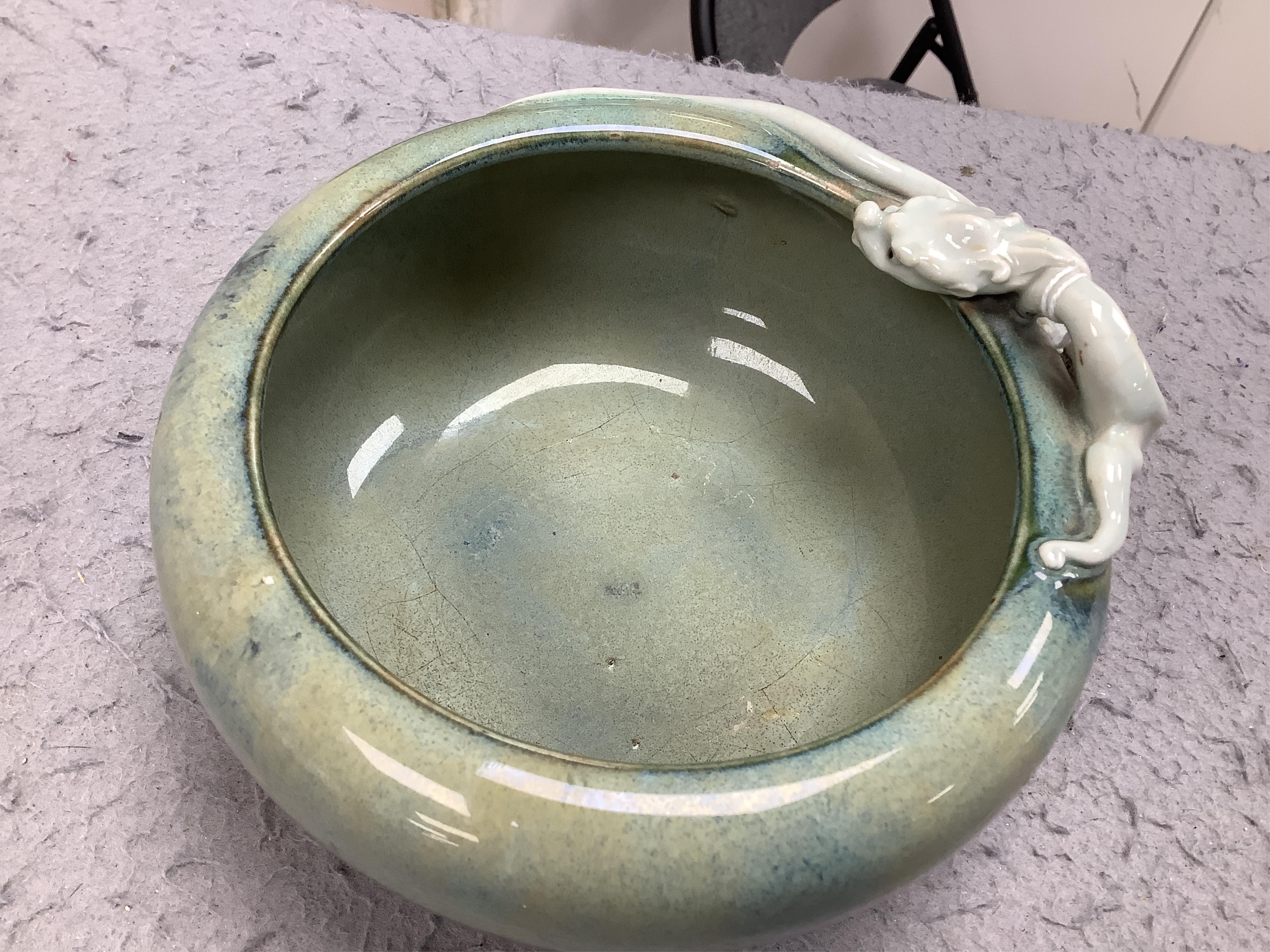 A Japanese Sumidagawa ware ‘dragon’ bowl, Meiji period, signed Ishiguro Koko, wood stand. Condition - scratching and crazing to the glaze on the interior otherwise good.